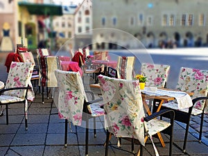 Street Cafe in the city Empty tables and chair waiting People Relax and cup of coffee travel to Europe Baltic state Old Town Of Ta