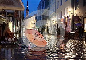 Night City Lights Rainy Season weather Tallinn Old Town Square Autumn evening in city street bokeh light  rainy night  umbrella
