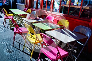 Street cafe tables on bright sunny day.