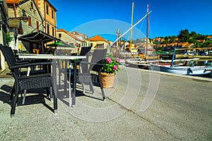 Street cafe with tables in the harbor, Vrboska, Dalmatia, Croatia