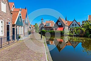 Street and Canal in Volendam Netherlands photo
