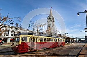 Street car or trollley or muni tram in front of San Francisco Ferry Building in Embarcadero - San Francisco, California, USA