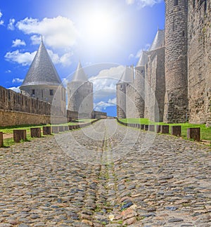 Street in Carcassone Old Town on soft sunlight photo