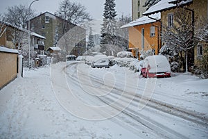 Street with cars buried after heavy snowfall