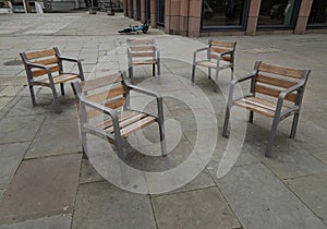 These street chairs look casually placed, but they\'re screwed into the floor for People can comfortably sit together