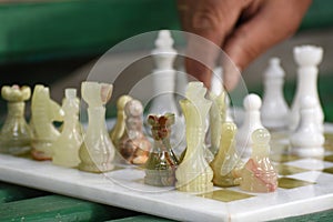 Street chess game. The grandmaster makes a pawn move. Tournament to International Chess Day