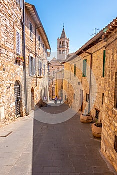 Street of city of Assisi, Italy, in a summer sunny day