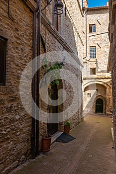 Street of city of Assisi, Italy, in a summer sunny day