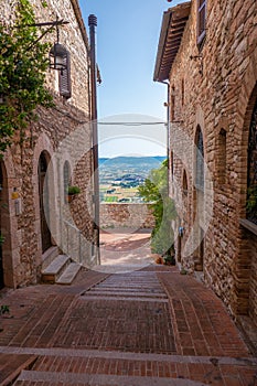 Street of city of Assisi, Italy, in a summer sunny day