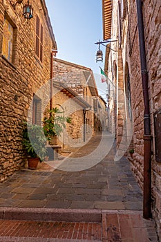 Street of city of Assisi, Italy, in a summer sunny day