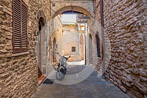 Street of city of Assisi, Italy, in a summer sunny day