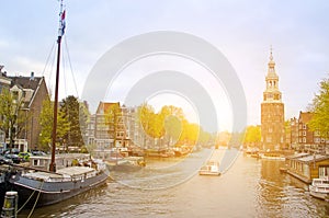 Street cityscape in Amsterdam, Netherlands, Europe. Canal, boat