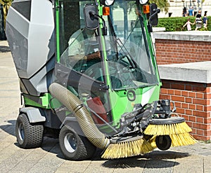 Street cleaner vehicle in the city