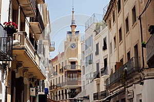 Street with clock on chapel and