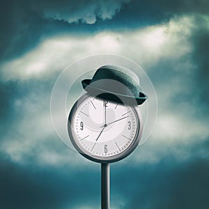 Street clock, in a hat, against the backdrop of a cloudy sky. Planning concept. Time management. Lack of time. Organization of