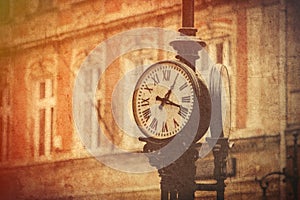 Street clock on a pole. Made in vintage style.