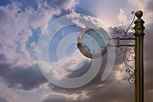 Street clock on sky background.