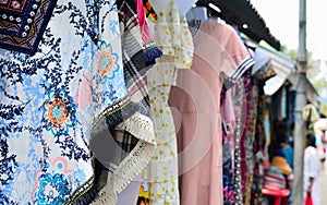 Street clothes shop women`s wear colorful dress street vendors