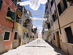 Street with cloths drying, Venice