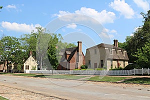 A street with colonial houses in the summer