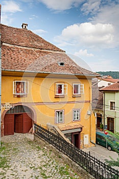 Street with colored houses in Sighisoara, Romania