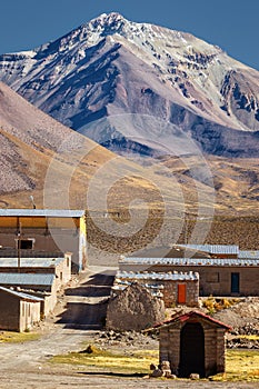 Street of the commune of Colchane, in the Tarapaca region, in the background Cerro Carabaya, Chile photo