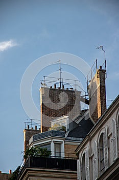Street corner flat with balconey and chimneys photo