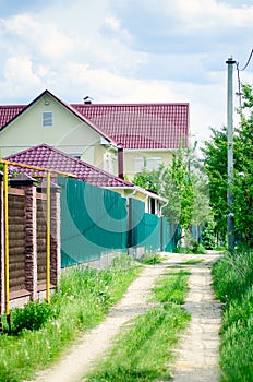 Street with country houses. Summer landscape