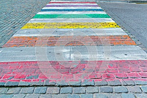 A street crossing painted in vibrant colours to represent gay pride