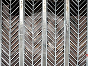 Street curly herringbone metal fence with geometric pattern