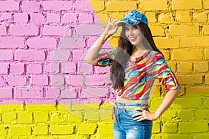 Street dance, freestyle and jazz funk concept - Beautiful girl hip-hop dancer over brick wall with copy space.