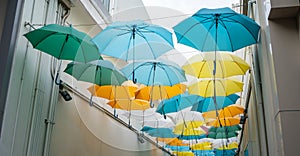 Street decorated with colored umbrellas. view of Umbrella Street