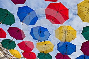 Street decoration, lots of colorful umbrellas in the air