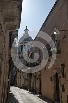 Street and dome of San Giorgio baroque city Ragusa Ibla, Sicilia, Italy photo