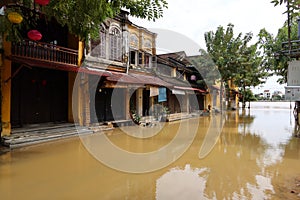 A street in downtown Hoi An, Vietnam along the Thu Bon River flooded during the 2021 rainy season