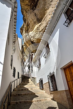 Street with dwellings built into rock overhangs Setenil de Las Bodegas photo