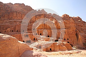 Street of Facades, which is caves with doors carved out of the red stone, Petra, Jordan