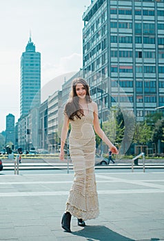 Street fashion beauty. City vogue. Fashion girl walking on streets of modern town.