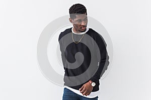 Street fashion concept - Studio shot of young handsome African man wearing sweatshirt against white background with copy