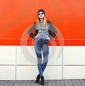 Street fashion concept - stylish hipster woman in rock