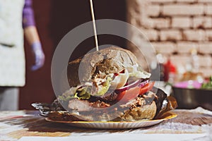 Street fast food, hamburger with bbq grilled steak