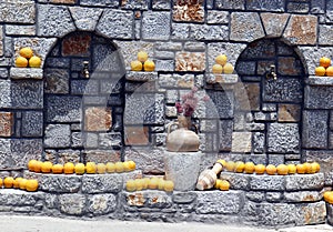 Street faucet, decoration oranges and amphorae