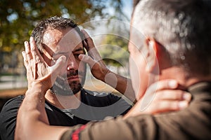 Street fighting self defense technique against holds and grabs