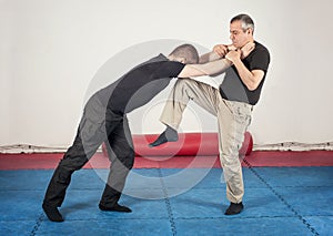 Street fighting self defense technique against holds and grabs