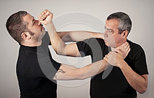 Street fighting self defense technique against holds and grabs