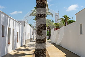 Street of the fishers village of Poble Nou del Delta with its typical white houses.