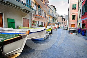 Street with fishing boats in an Italian village Manarola