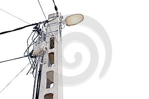 Street flood light post with   lot of wires against  white sky background. With space for text. Energy distribution concept