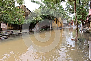 A street flooded by heavy rains that overflow the Thu Bon River in Hoi An, Vietnam