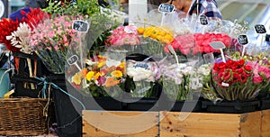 Street florist in South France, colorful fresh flowers in the main street of Cannes.